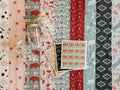 Collection of western-style patterned waffle-weave tea towels with various designs, including stars, florals, animals, and geometric shapes, 3 western-style can glasses, and 3 western-style Swedish dishcloths.